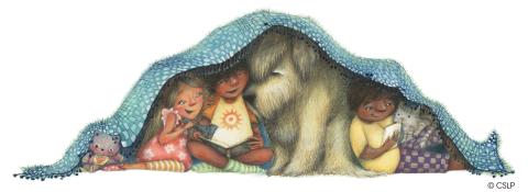 Children reading under a blanket