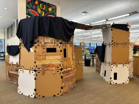 A large cardboard fort fills the Children's Room entryway.