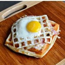 A waffle with an egg on top.