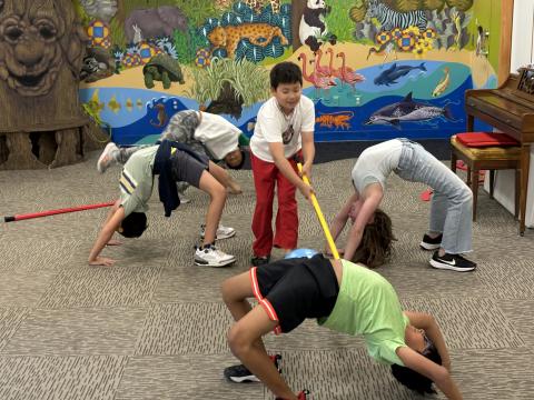Children have fun with balloons.