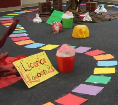 Colorful squares form a path on a gray carpet.