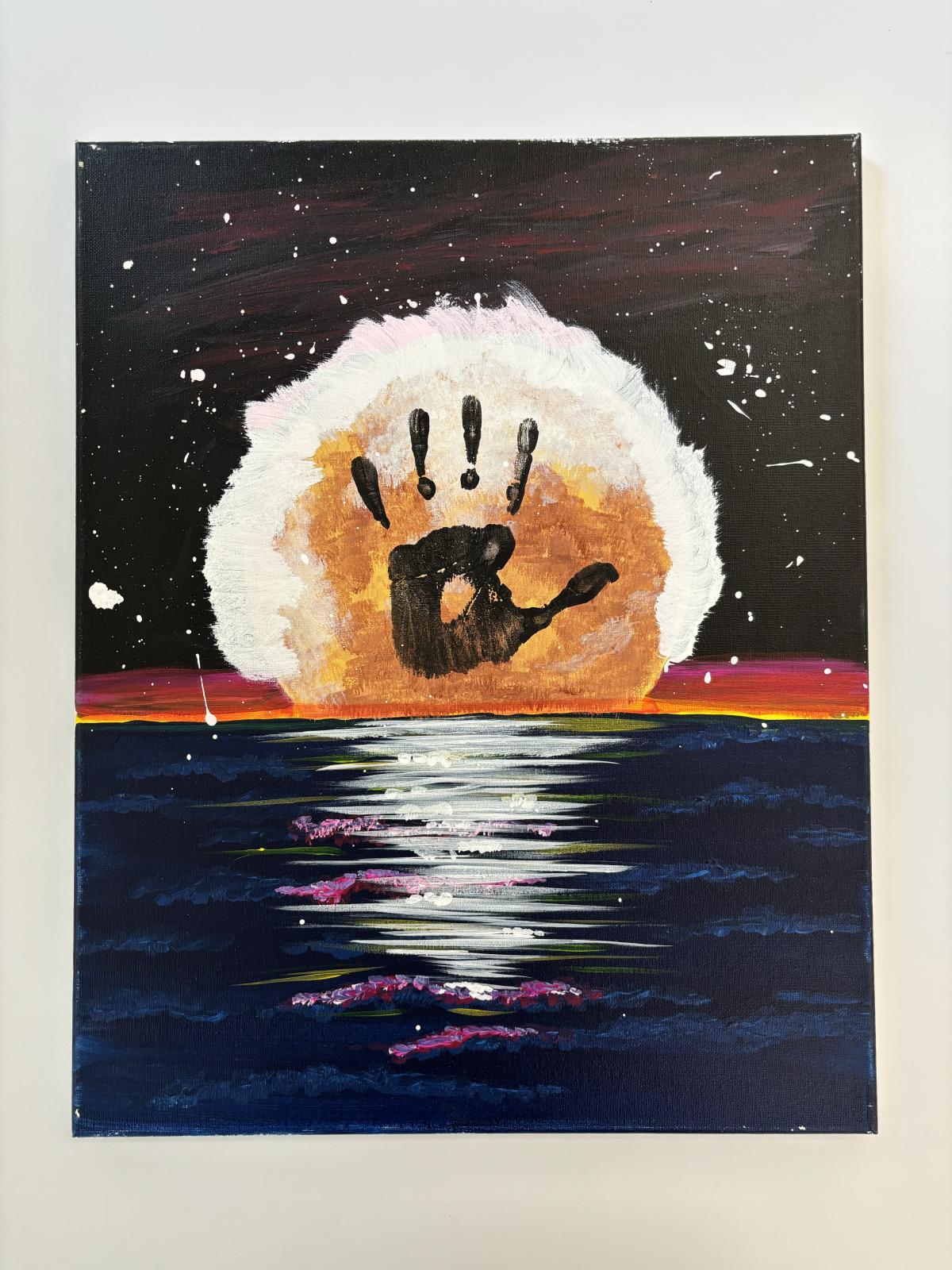 A painting of a setting sun with a black hand print in its center.