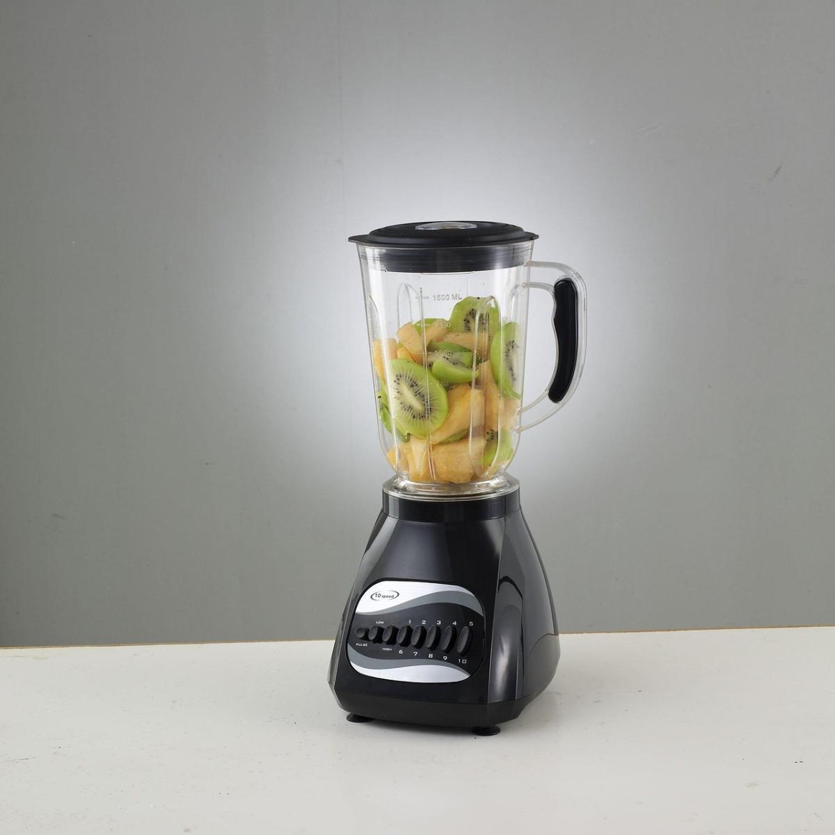 A blender containing fruit.