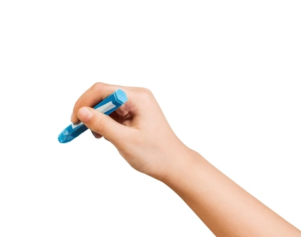 A child's hand holding a crayon